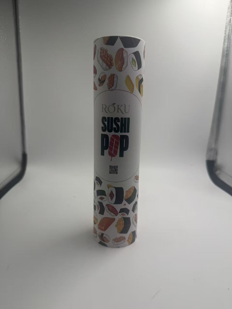 Sushi Packaging: Custom Printed Push Pop Tube Design Guide 2 Illustrated RŌKU SUSHI POP tube sample with central branding and QR code